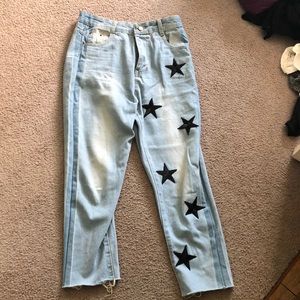light wash jeans with embroidered black stars